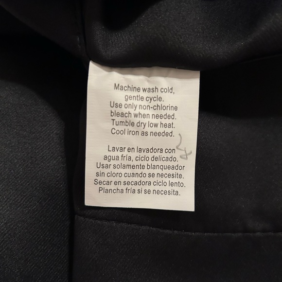 Four (4) black curtain panels. Metal grommets fit rods up to 1.5" in diameter. - Picture 5 of 5